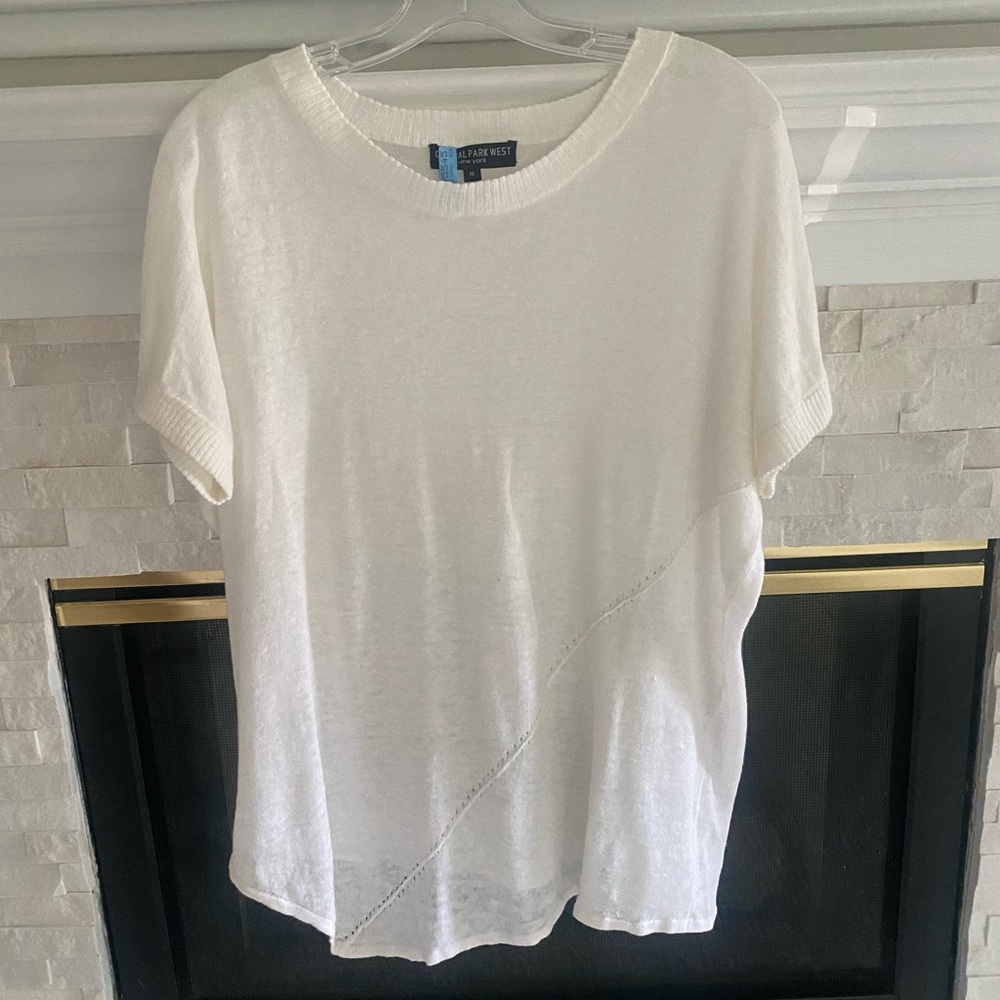 White tee/light sweater material like new condition.